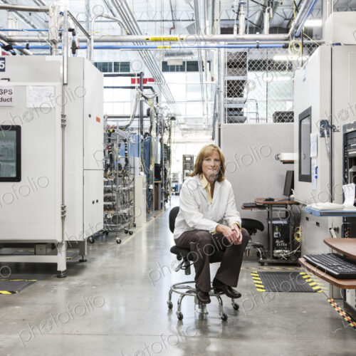 A portrait of a caucasian female technician in a technical research and development site. A portrait of a caucasian female technician in a technical research and development site.