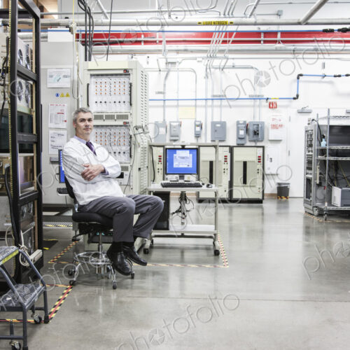 A portrait of a caucasian male technician in a technical research and development site. A portrait of a caucasian male technician in a technical research and development site.
