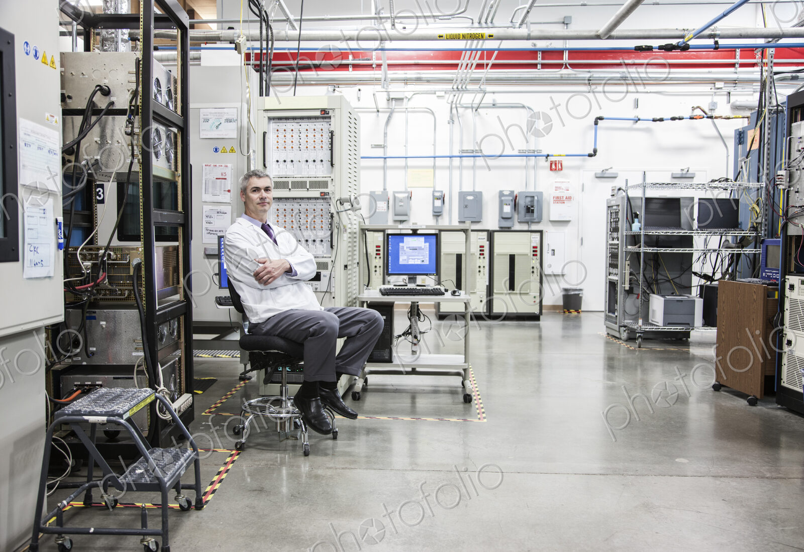 A portrait of a caucasian male technician in a technical research and development site.