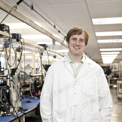 A portrait of a caucasian male technician in a technical research and development site.