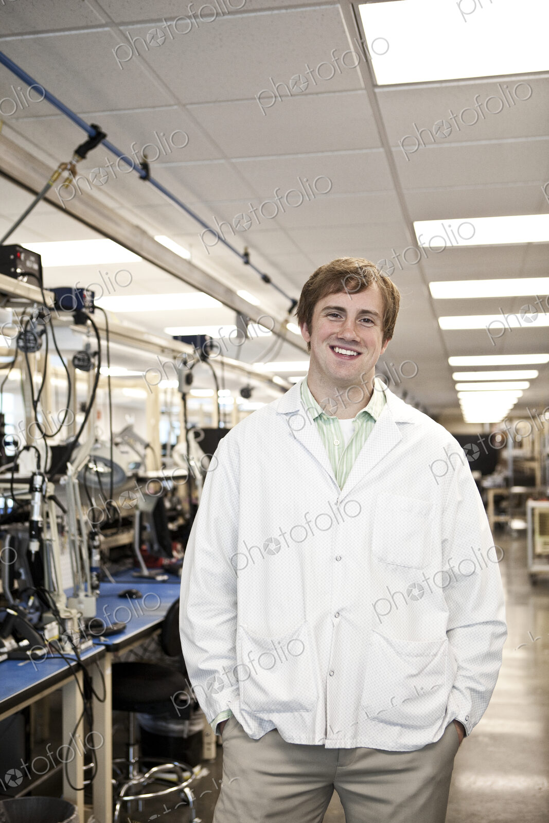A portrait of a caucasian male technician in a technical research and development site.