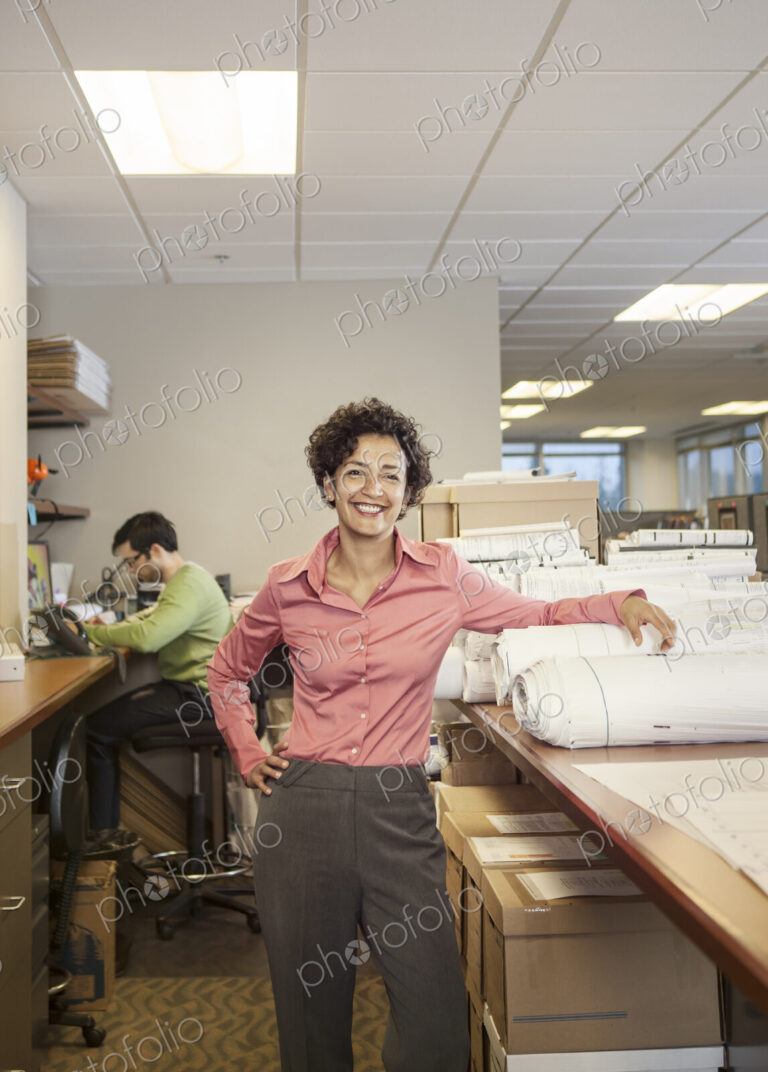 A portrait of a female architect in her office.