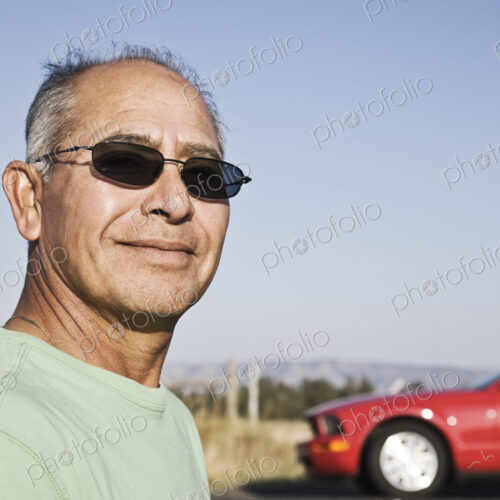 A portrait of a hip senior Hispanic male on a road trip. A portrait of a hip senior Hispanic male on a road trip.