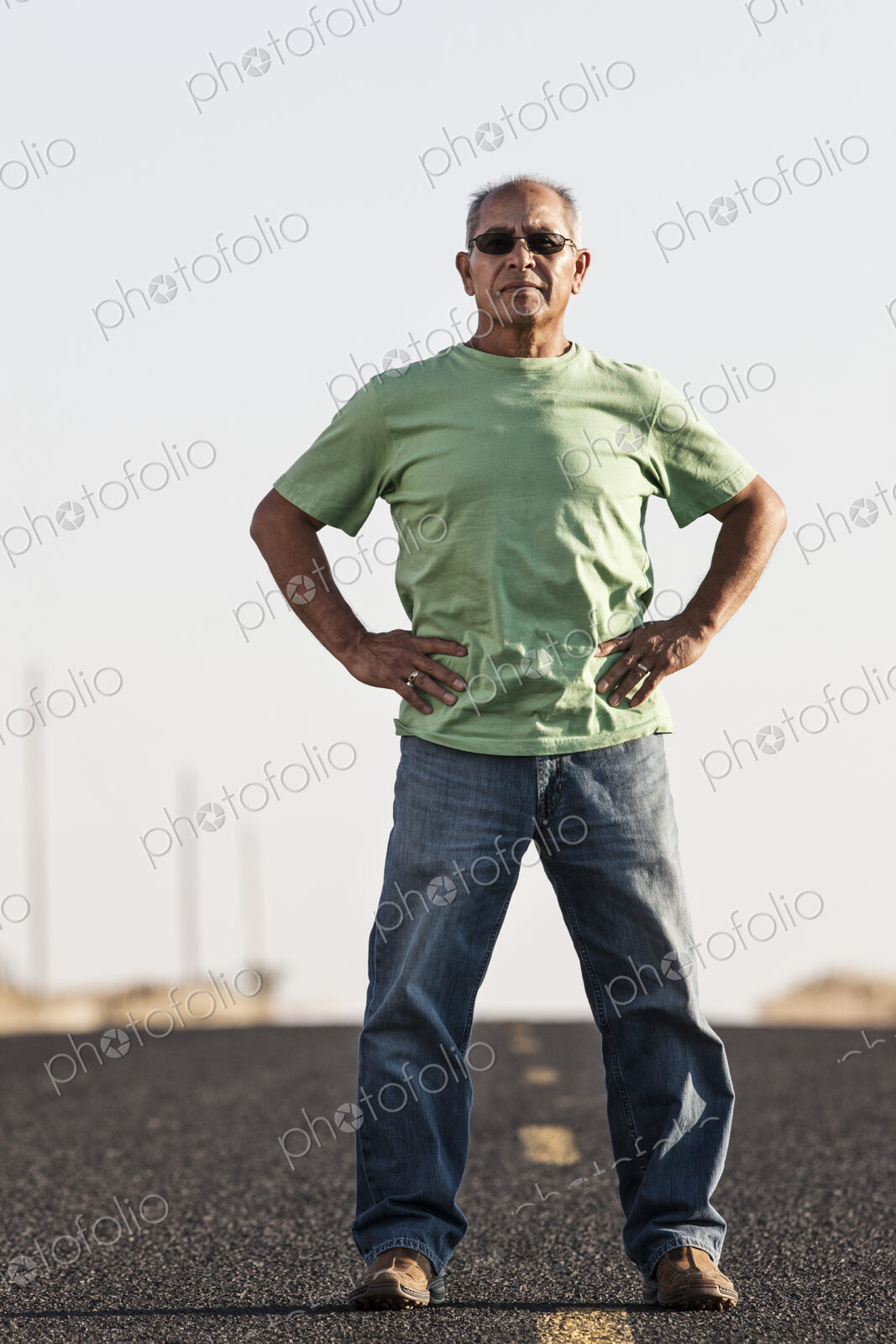 A portrait of a hip senior Hispanic male on a road trip.