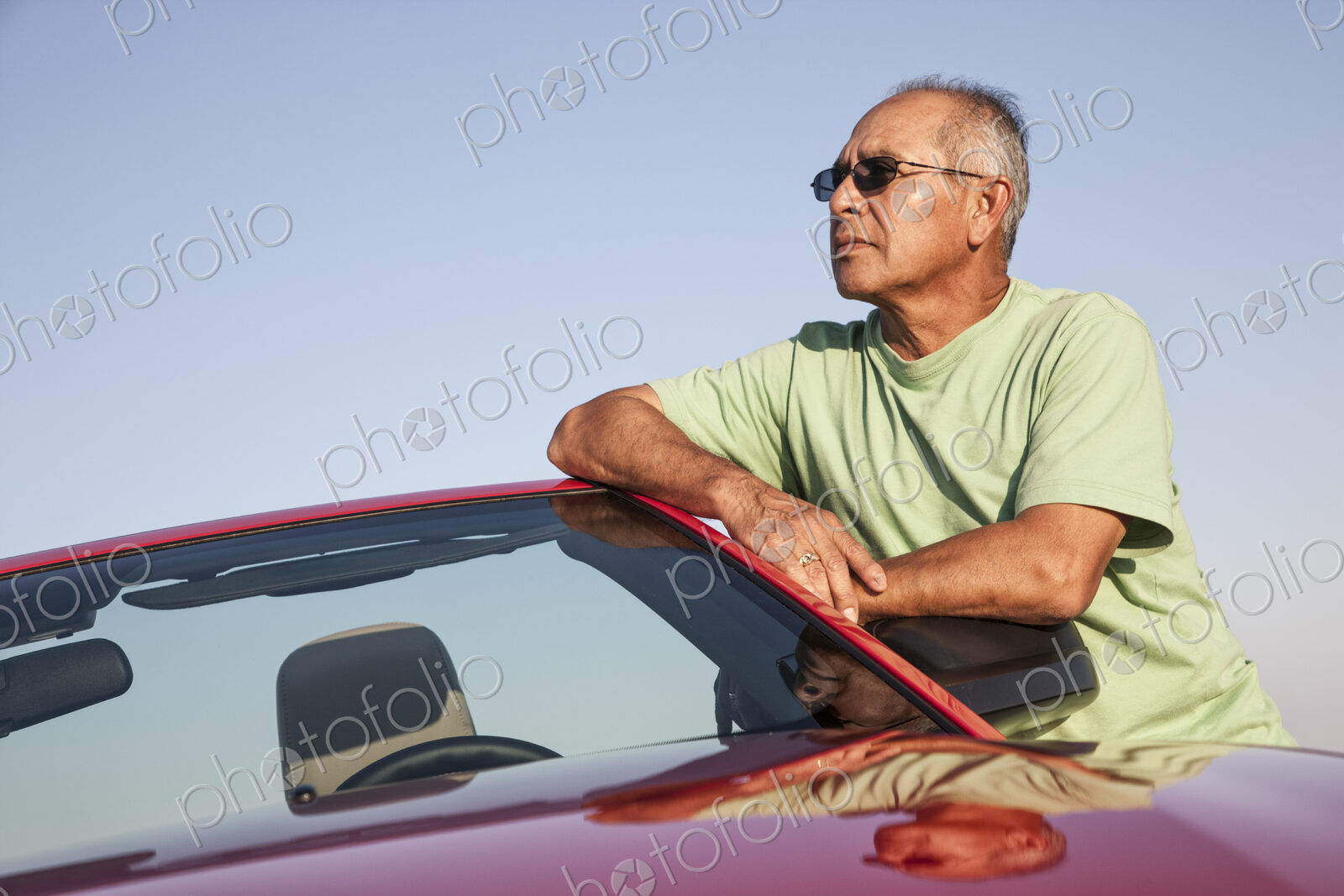 A portrait of a hip senior Hispanic male on a road trip.