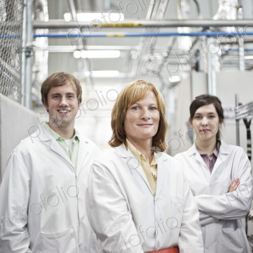A portrait of a team of technicians in a technical research and development site. A portrait of a team of technicians in a technical research and development site.