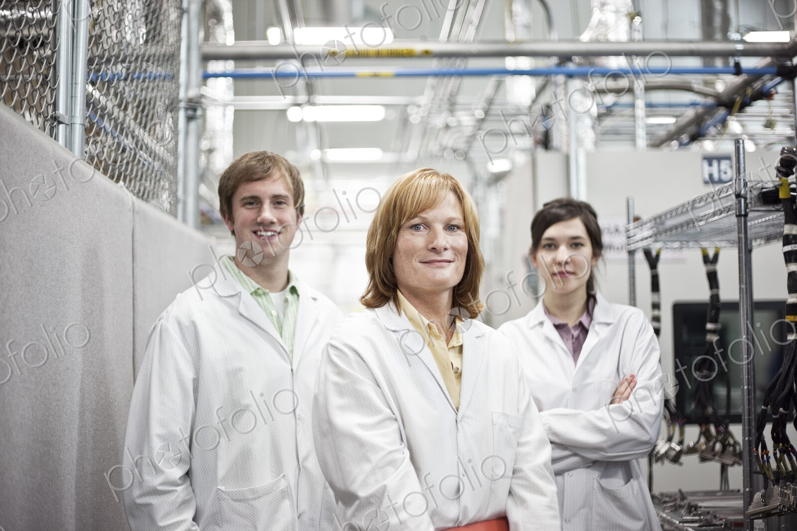 A portrait of a team of technicians in a technical research and development site.