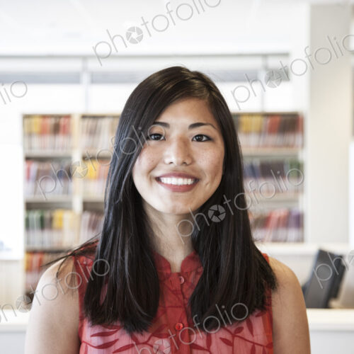 A portrait of an Asian businesswoman in her office looking at the camera. A portrait of an Asian businesswoman in her office looking at the camera.