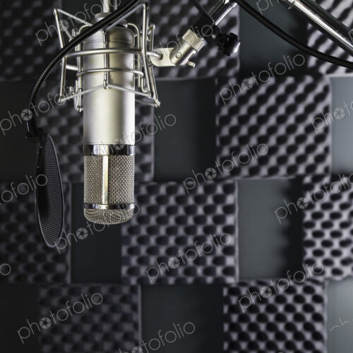 A professional microphone in a home recording studio with sound proof walls A professional microphone in a home recording studio with sound proof walls