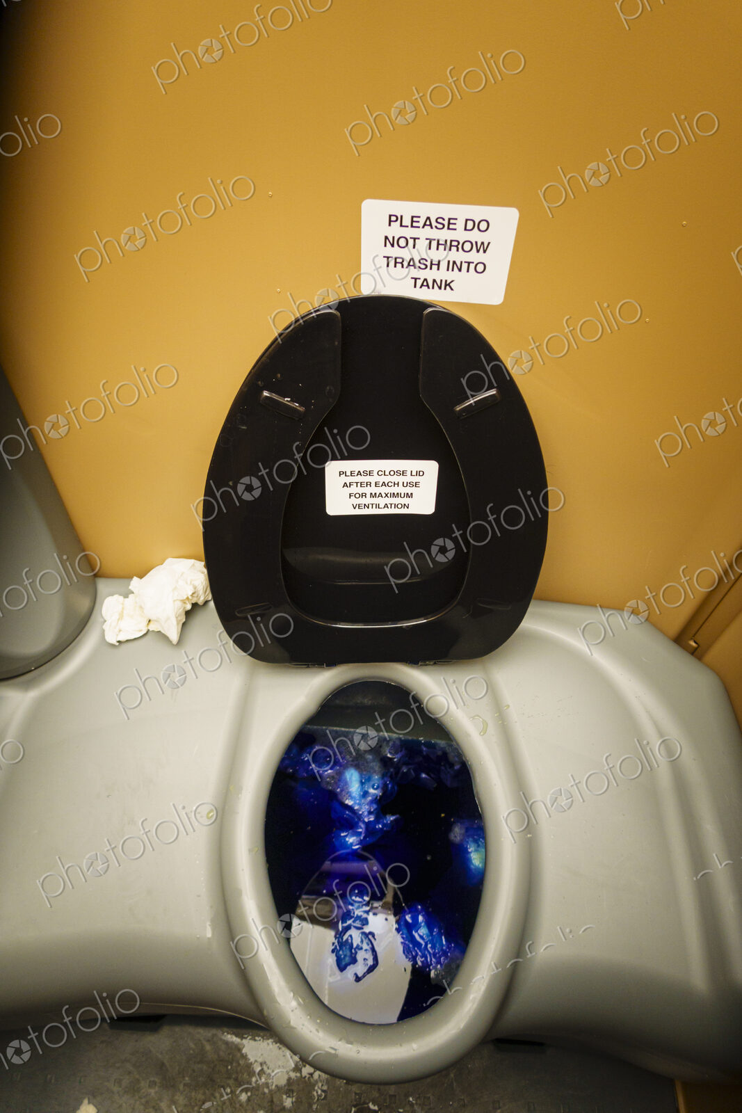 A public restroom toilet cubicle, a toilet at a reststop on a major road.