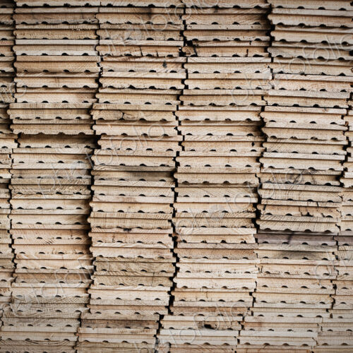 A reclaimed lumber workshop. Stacks of reclaimed, cleaned up planks of wood for re-use. A reclaimed lumber workshop. Stacks of reclaimed, cleaned up planks of wood for re-use.