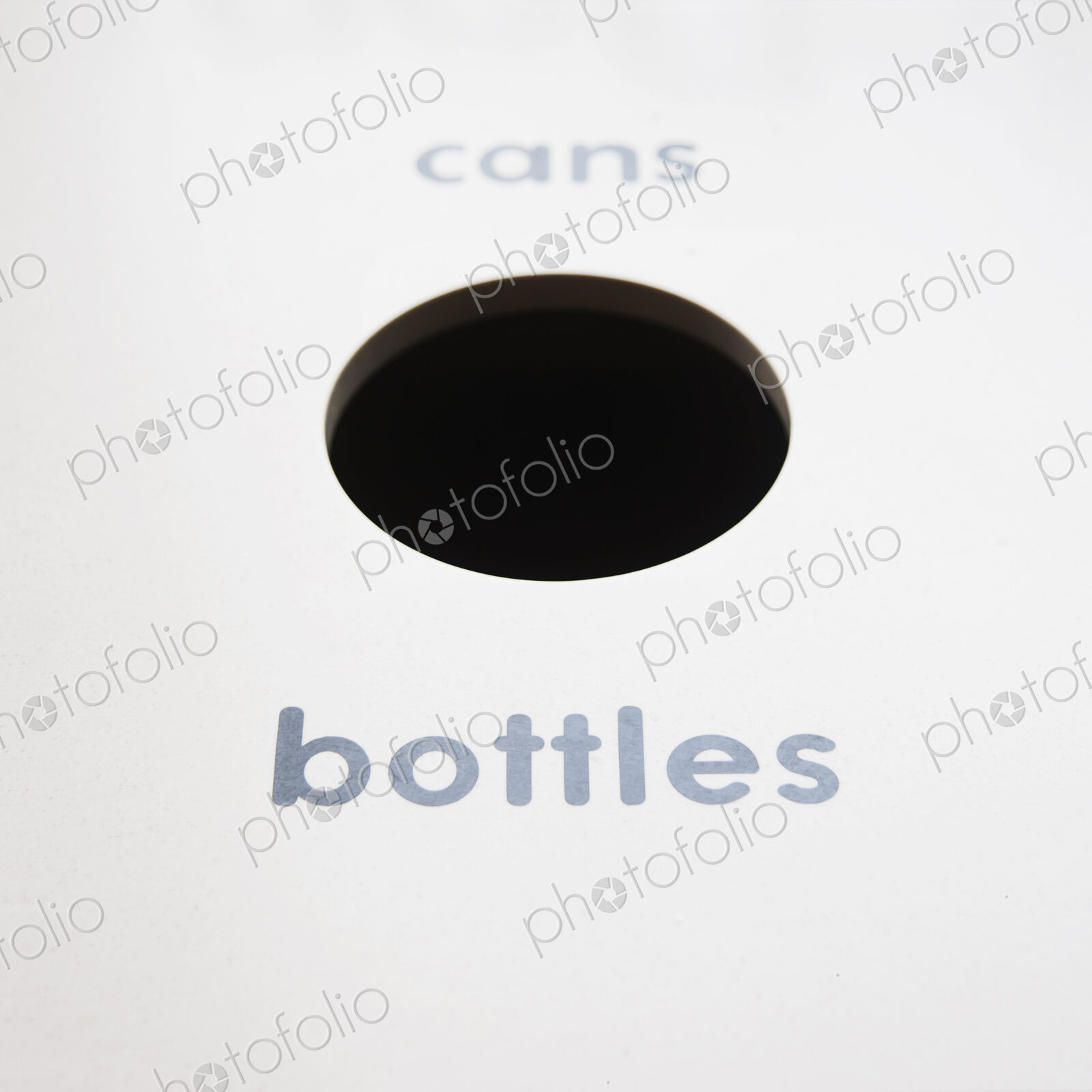A recycling bin for bottles and cans.