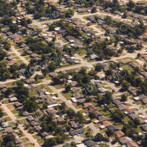 A residential area, an aerial view of the houses, layout and gardens and the roads in…