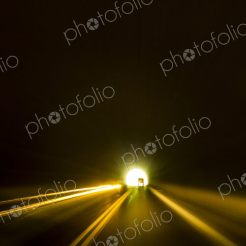 A road tunnel, Mount Rainier National Park, darkness in the tunnel and a light at the end.