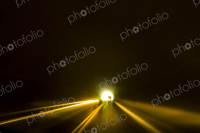 A road tunnel, Mount Rainier National Park, darkness in the tunnel and a light at the end.