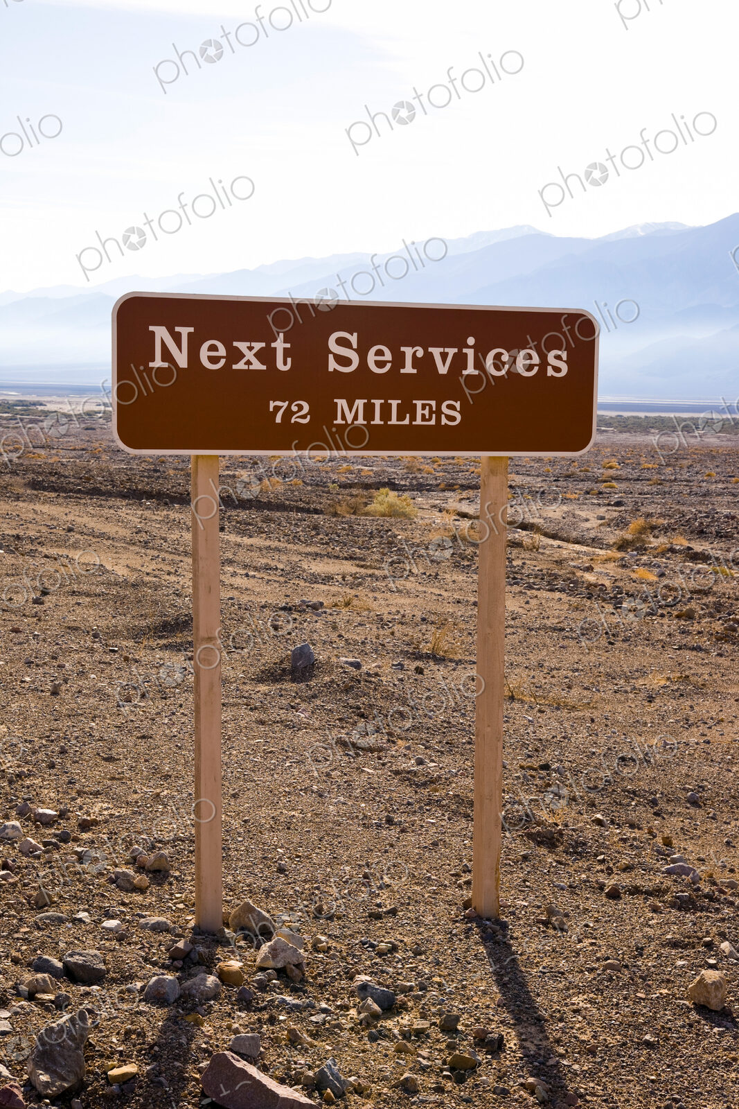 A roadside sign in Death Valley, CA, USA. Next Services 72 Miles.