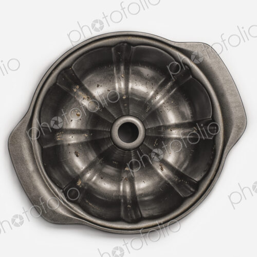 A round metal strainer, or lemon juicer. A round metal strainer, or lemon juicer.