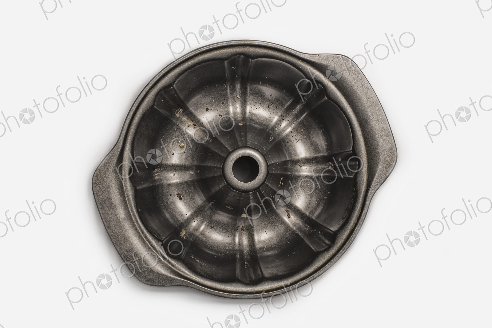 A round metal strainer, or lemon juicer.