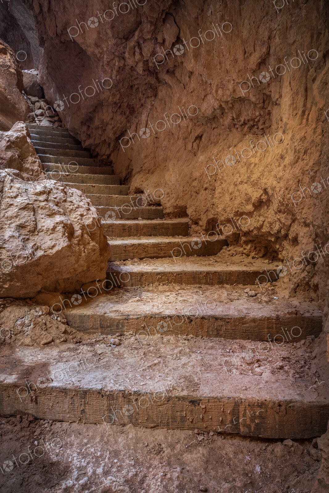 A rugged stairway carved into the canyon walls of Bryce Canyon, leading upward through…