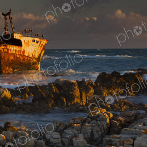 A rusting wreck, an abandoned ship off the shore of Arniston, on the shores of Cape South. A rusting wreck, an abandoned ship off the shore of Arniston, on the shores of Cape South.
