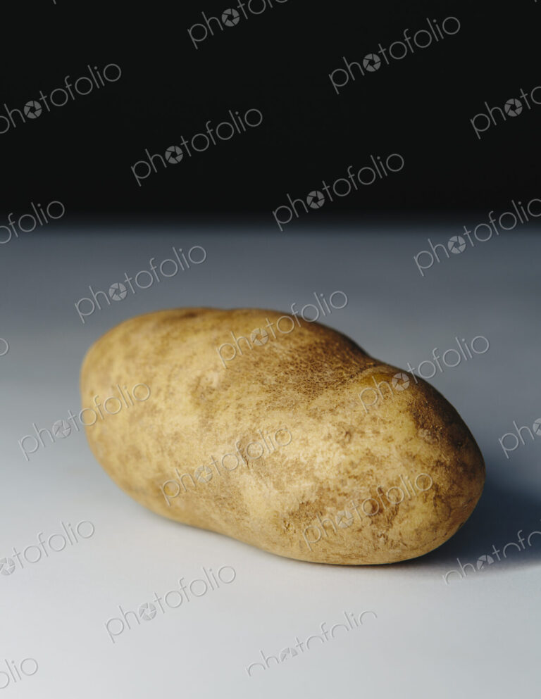 A scrubbed clean organic russet potato.