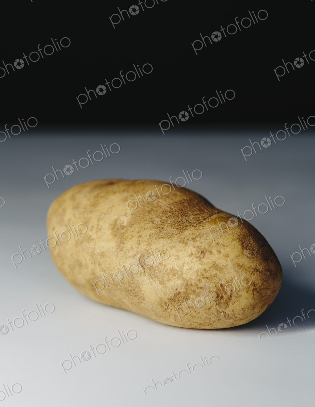 A scrubbed clean organic russet potato.