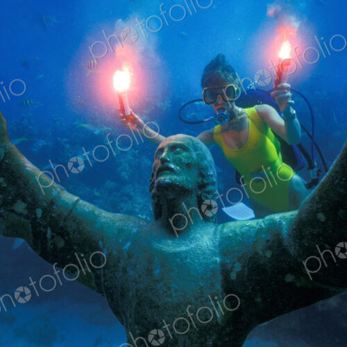 A scuba diver with underwater flares, celebrating the 25th anniversary of the… A scuba diver with underwater flares, celebrating the 25th anniversary of the…