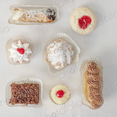A selection of party desserts, organic food, and dainty cakes and pastries.