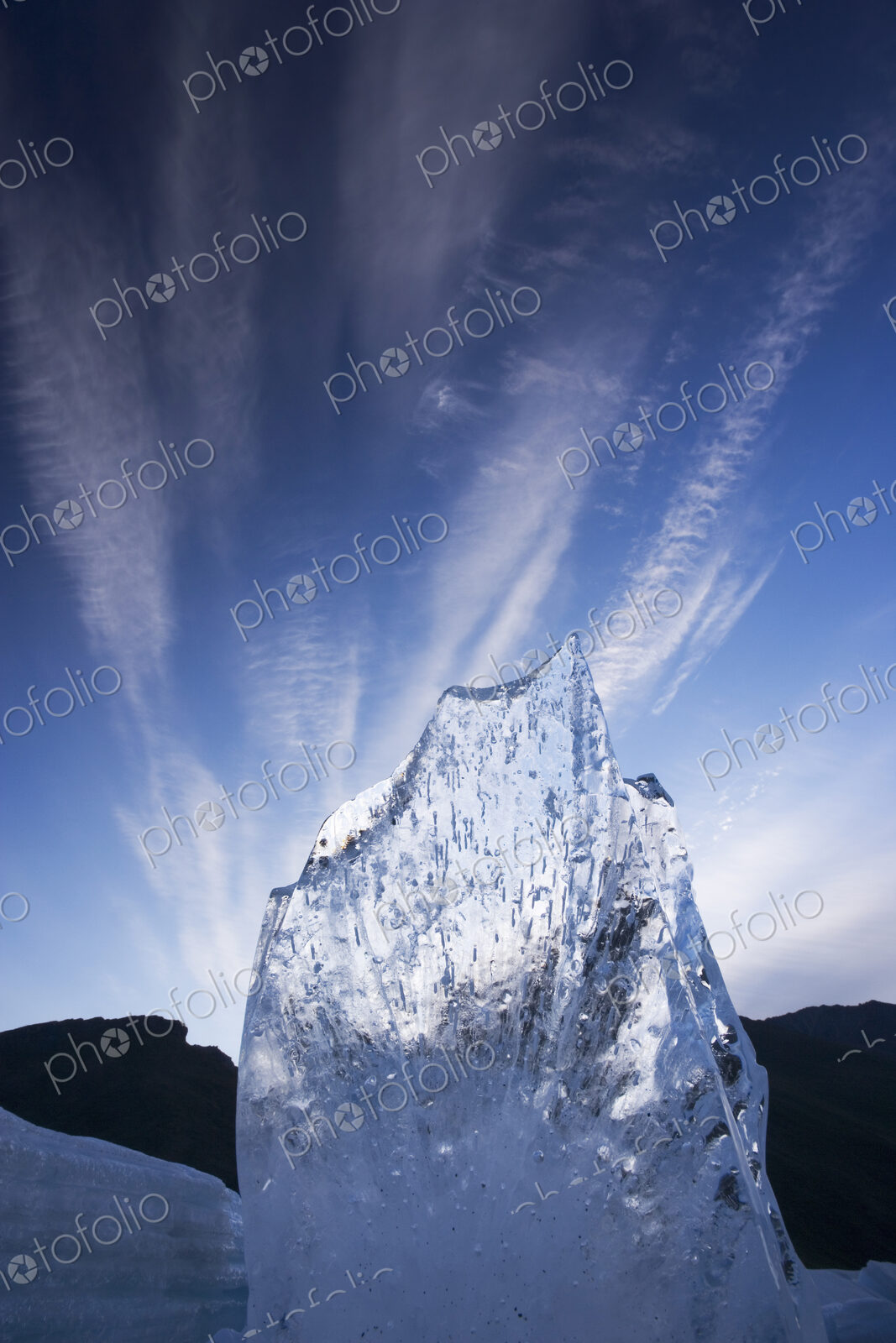 A shard of aufeis reaches toward the arctic sky.