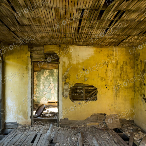 A shell of a building, a derelict house interior, exposed timbers and peeling… A shell of a building, a derelict house interior, exposed timbers and peeling…