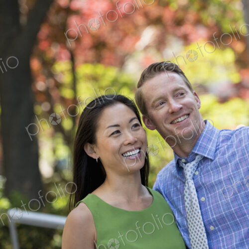 A small group of people, a businesswoman and two businessmen outdoors in the city. A small group of people, a businesswoman and two businessmen outdoors in the city.