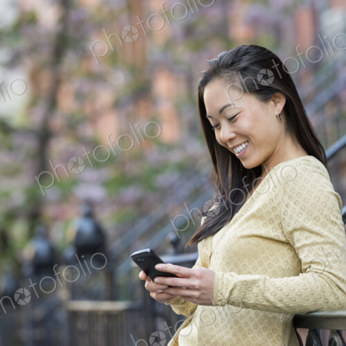 A small group of people, a businesswoman and two businessmen outdoors in the city. A small group of people, a businesswoman and two businessmen outdoors in the city.
