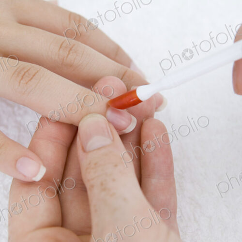 A spa treatment centre. A young woman having a manicure. A spa treatment centre. A young woman having a manicure.