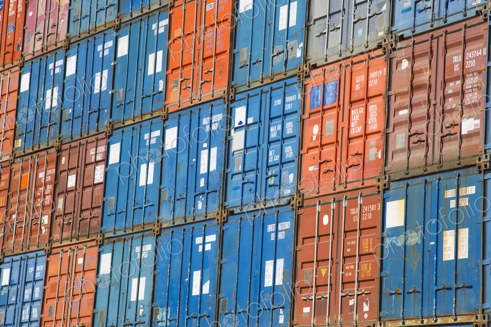 A stack of cargo containers, commercial freight containers, packed together and…