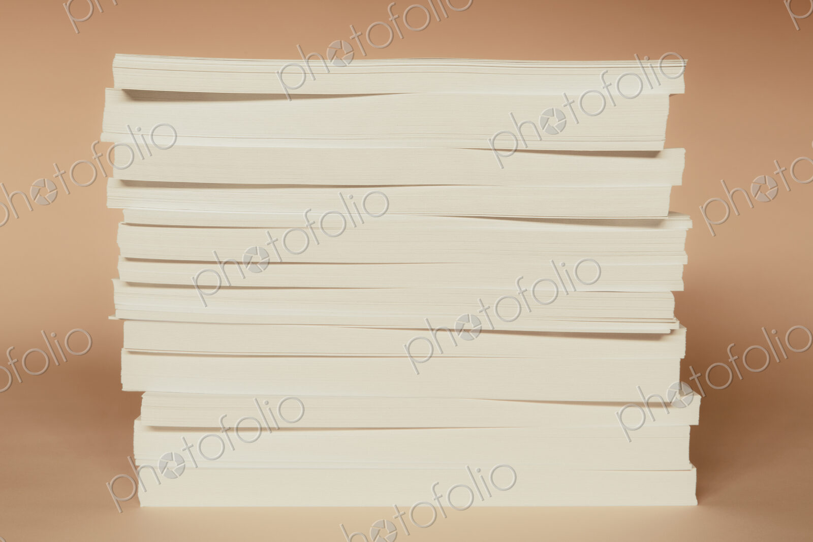 A stack of recycled white paper, paper supplies.