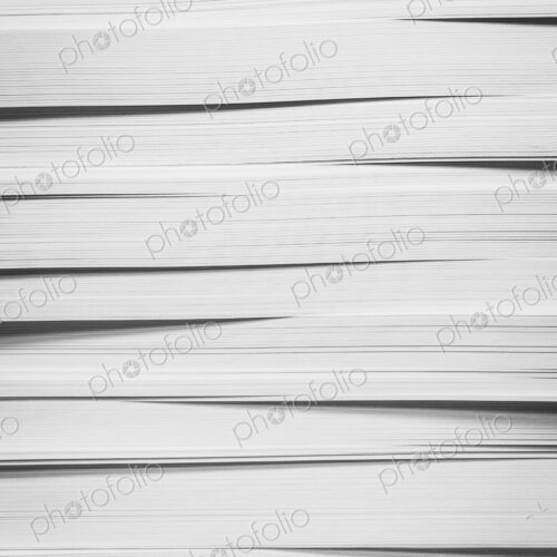 A stack of recycled white paper, paper supplies.