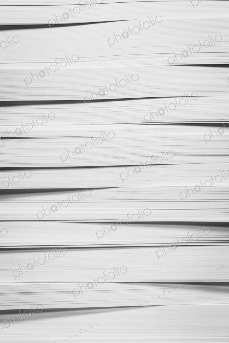 A stack of recycled white paper, paper supplies.