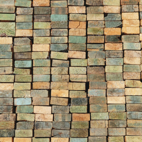 A stack of wood stud boards known as 2 x 4s. Used for construction and scaffolding.