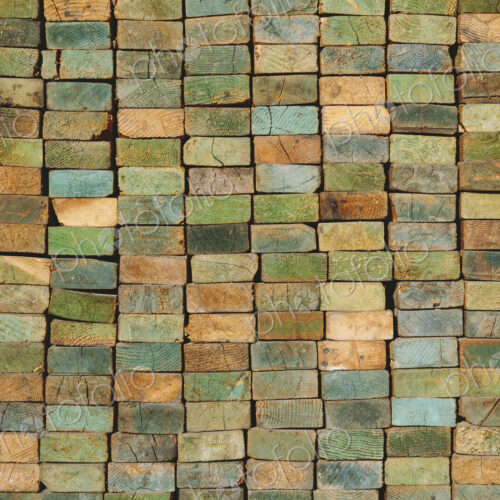 A stack of wood stud boards known as 2 x 4s. Used for construction and scaffolding.