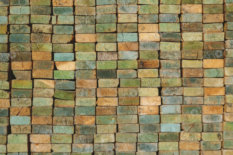 A stack of wood stud boards known as 2 x 4s. Used for construction and scaffolding.
