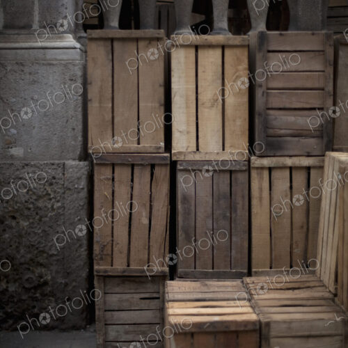 A stack of wooden crates, in the corner of a room. A stack of wooden crates, in the corner of a room.