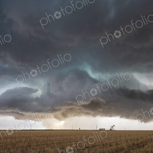A supercell event, a severe warning storm, a layer of clouds just above the horizon.