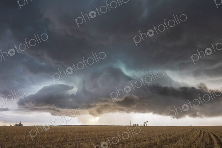 A supercell event, a severe warning storm, a layer of clouds just above the horizon.