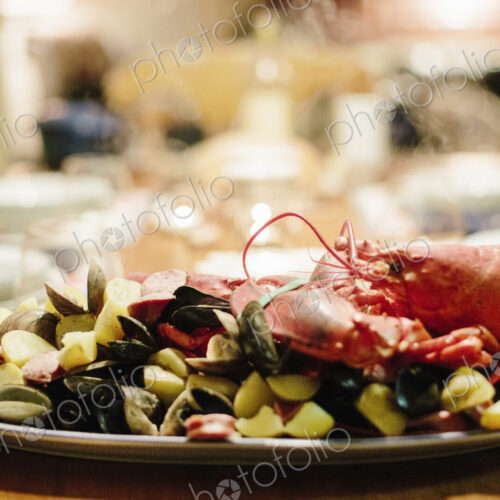 A table laid for a meal, a seafood platter with lobster and clams. A table laid for a meal, a seafood platter with lobster and clams.