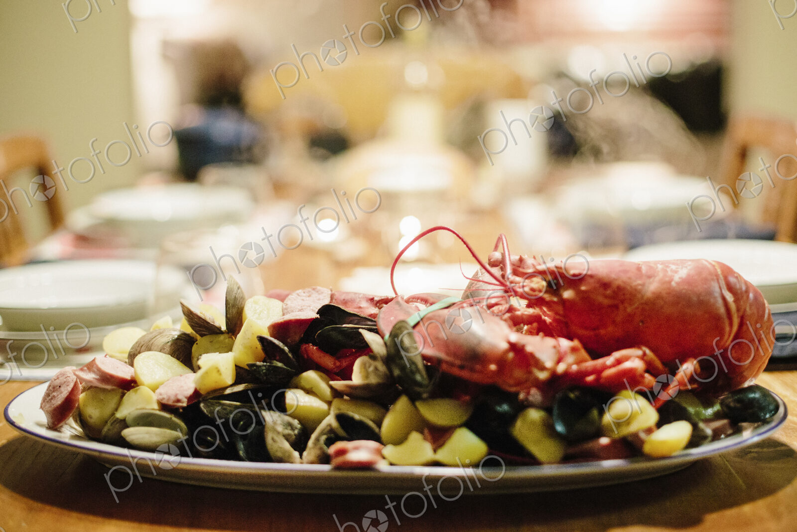 A table laid for a meal, a seafood platter with lobster and clams.