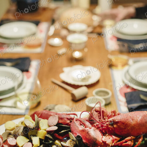 A table laid for a meal, a seafood platter with lobster and clams. A table laid for a meal, a seafood platter with lobster and clams.