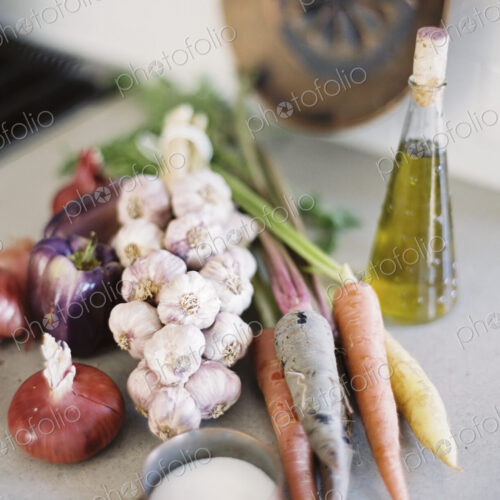 A tabletop. A group of fresh organic vegetables, carrots and onions, garlic and… A tabletop. A group of fresh organic vegetables, carrots and onions, garlic and…