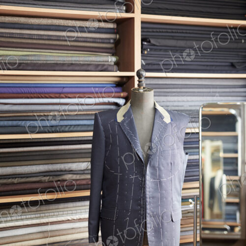 A tailormade jacket on a mannequin, half finished.