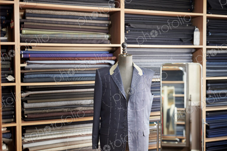 A tailormade jacket on a mannequin, half finished.