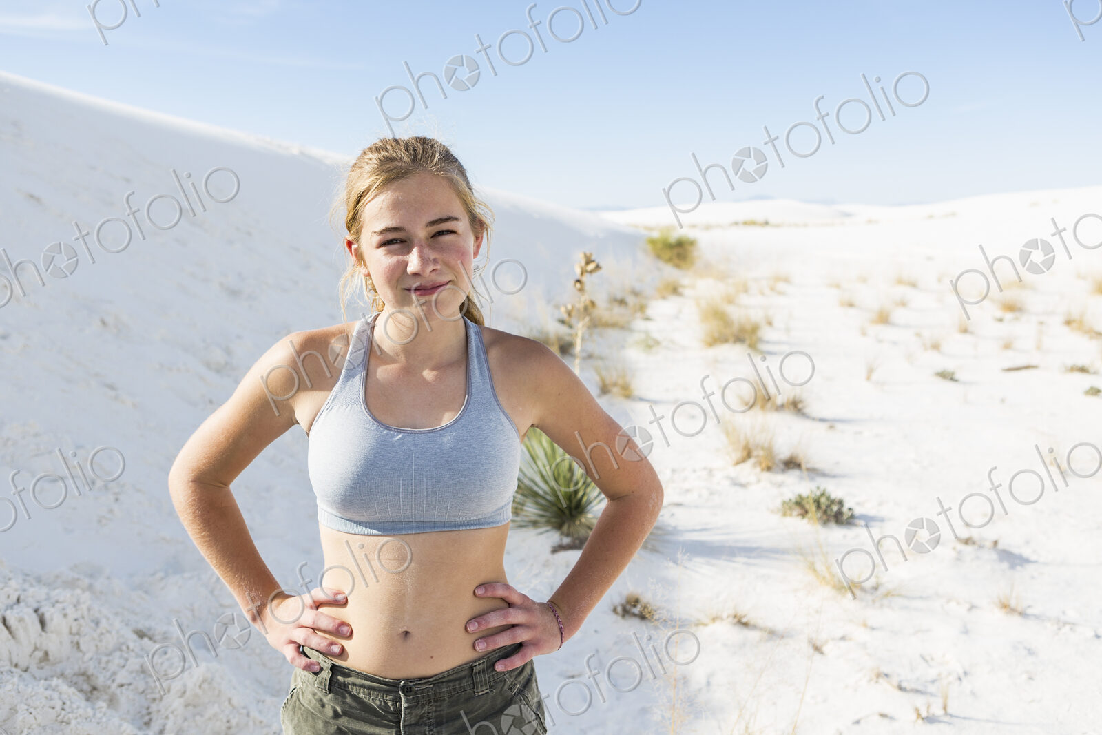A teenage girl in the open landscape of White Sands Nat’l Monument, NM
